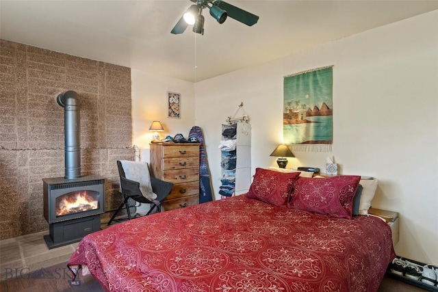 707 Montana St, Belgrade, MT 59714 - bedroom with a wood stove and a ceiling fan