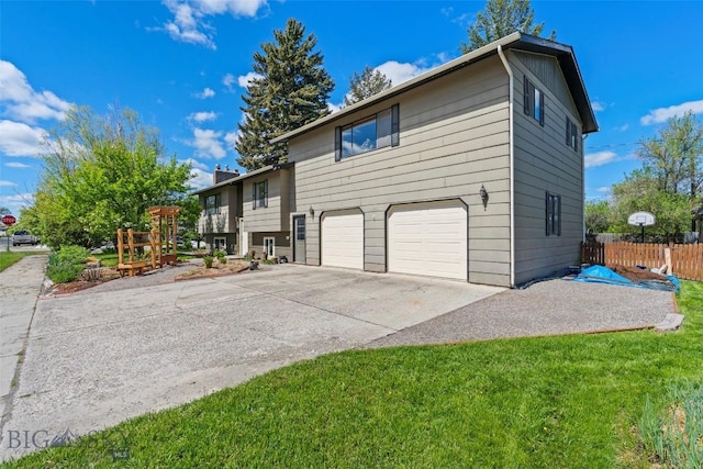 707 Montana St, Belgrade, MT 59714 - view of home's exterior with an attached garage and driveway