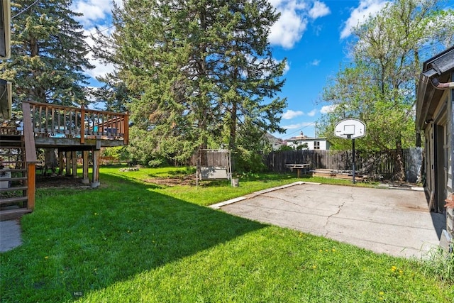 707 Montana St, Belgrade, MT 59714 - fenced backyard featuring a deck, stairway, and a patio