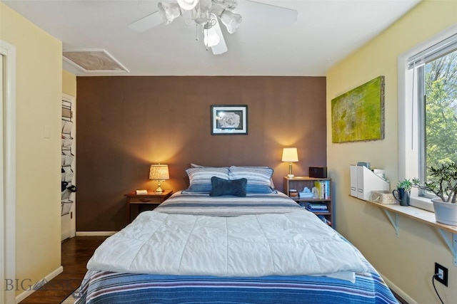 707 Montana St, Belgrade, MT 59714 - bedroom with dark wood-style flooring, a ceiling fan, and attic access