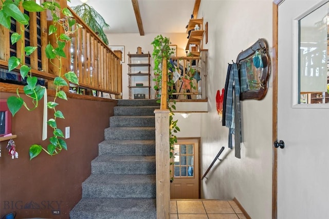 707 Montana St, Belgrade, MT 59714 - staircase featuring beam ceiling and tile patterned flooring