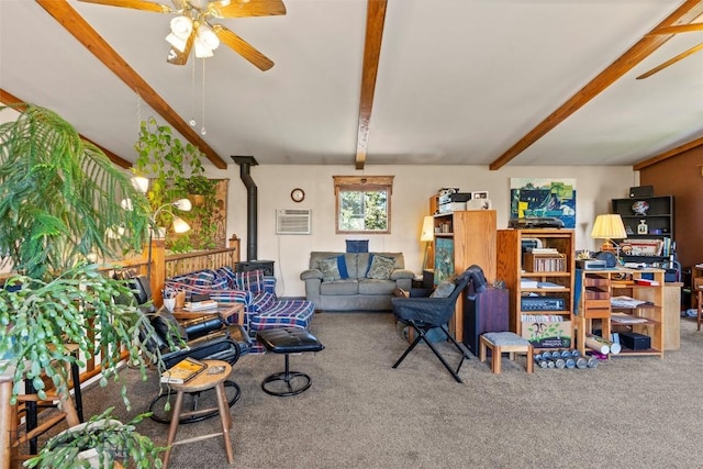 707 Montana St, Belgrade, MT 59714 - carpeted living area with beam ceiling, ceiling fan, a wood stove, and a wall mounted AC