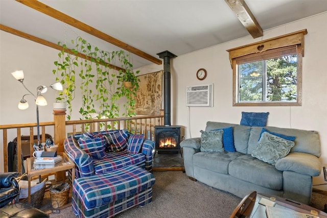 707 Montana St, Belgrade, MT 59714 - living room featuring beam ceiling, a wall mounted AC, a wood stove, and carpet floors