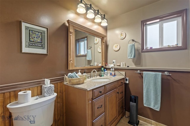 707 Montana St, Belgrade, MT 59714 - bathroom with plenty of natural light, vanity, toilet, and tile patterned floors