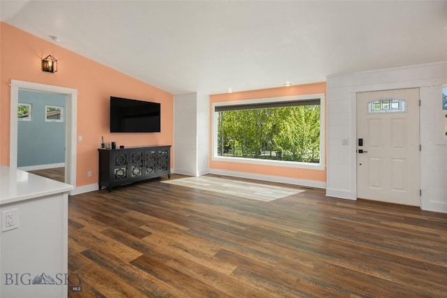 307 Flathead Ave, Bozeman, MT 59718 - unfurnished living room featuring lofted ceiling, dark wood-style floors, and baseboards