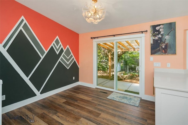 307 Flathead Ave, Bozeman, MT 59718 - unfurnished dining area with a chandelier, wood finished floors, and baseboards