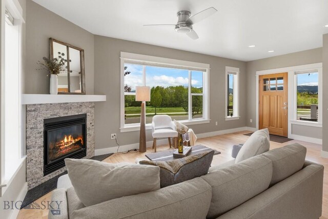 5333 Westmorland Dr, Bozeman, MT 59718 - living room featuring baseboards, a ceiling fan, a fireplace, wood finished floors, and recessed lighting