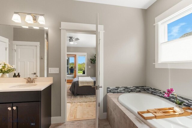 5333 Westmorland Dr, Bozeman, MT 59718 - ensuite bathroom with vanity, a bath, and a ceiling fan