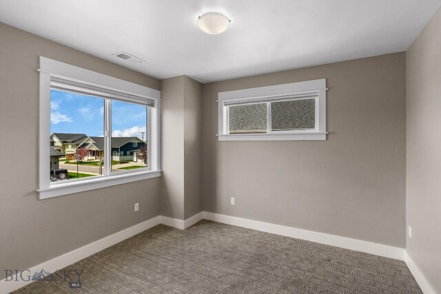 5333 Westmorland Dr, Bozeman, MT 59718 - carpeted empty room with plenty of natural light and baseboards