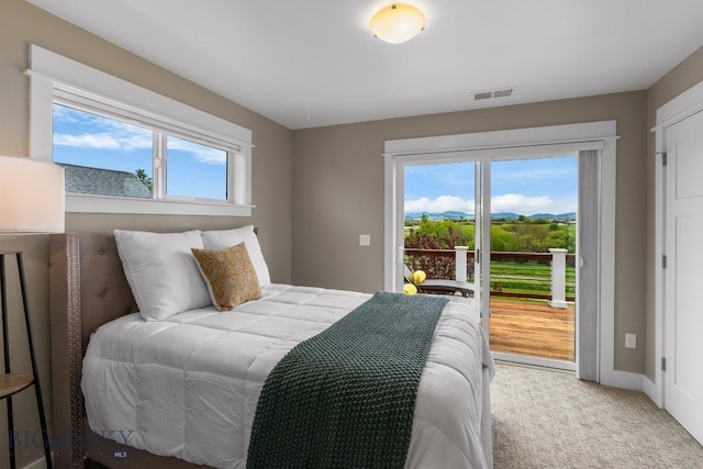 5333 Westmorland Dr, Bozeman, MT 59718 - bedroom featuring access to outside, light colored carpet, and baseboards