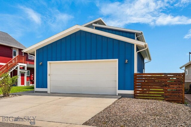 5333 Westmorland Dr, Bozeman, MT 59718 - modern home with board and batten siding, concrete driveway, and a garage