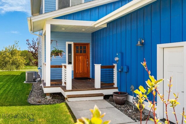 5333 Westmorland Dr, Bozeman, MT 59718 - property entrance featuring a yard, cooling unit, and board and batten siding