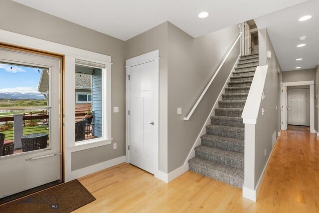 5333 Westmorland Dr, Bozeman, MT 59718 - foyer with light wood-style floors, stairway, baseboards, and recessed lighting