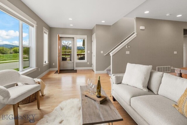5333 Westmorland Dr, Bozeman, MT 59718 - living room featuring light wood finished floors, recessed lighting, baseboards, and stairs
