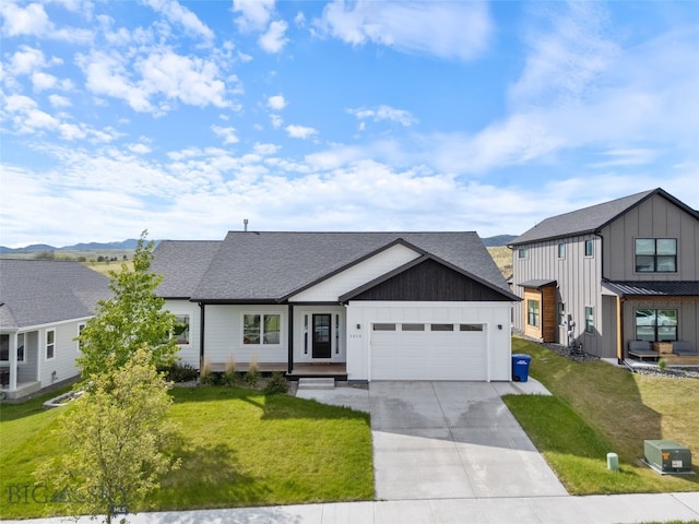 1215 Sweetgrass Ln, Livingston, MT 59047 - modern inspired farmhouse with board and batten siding, a garage, driveway, a front lawn, and a shingled roof