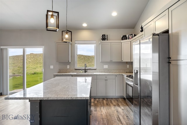 1215 Sweetgrass Ln, Livingston, MT 59047 - kitchen with stainless steel appliances, a sink, a center island, healthy amount of natural light, and recessed lighting
