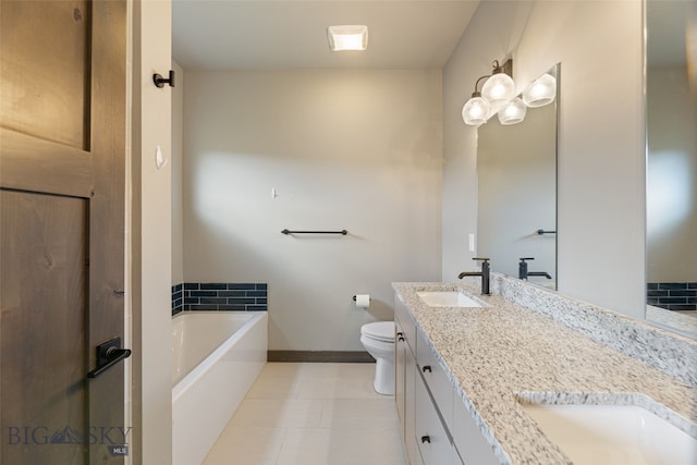 1215 Sweetgrass Ln, Livingston, MT 59047 - full bathroom with double vanity, a garden tub, baseboards, and toilet