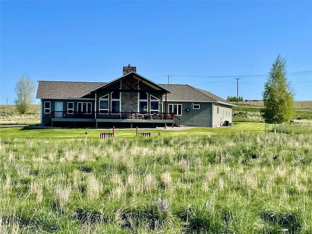 30 Harris Hawk Ct, Dillon, MT 59725 - back of property featuring a deck and a chimney