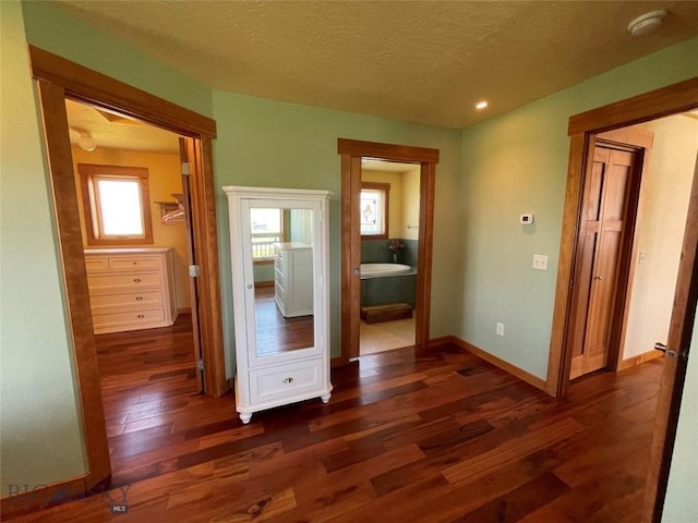 30 Harris Hawk Ct, Dillon, MT 59725 - corridor with dark wood-style floors, baseboards, a textured ceiling, and recessed lighting