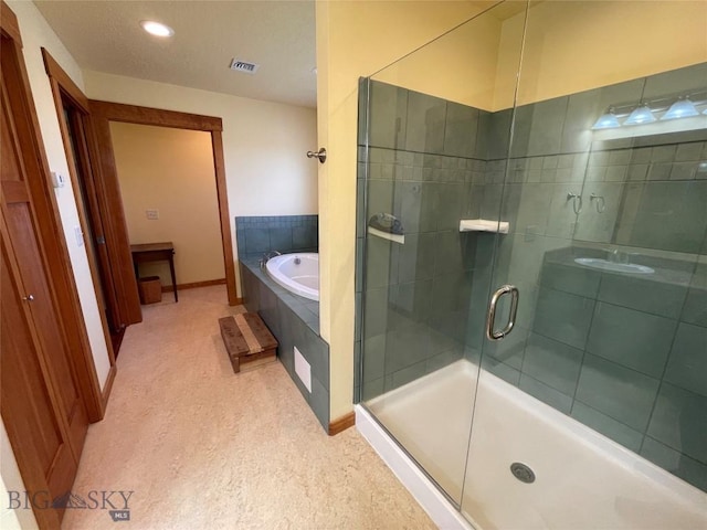 30 Harris Hawk Ct, Dillon, MT 59725 - full bath featuring a bath, a stall shower, baseboards, and recessed lighting
