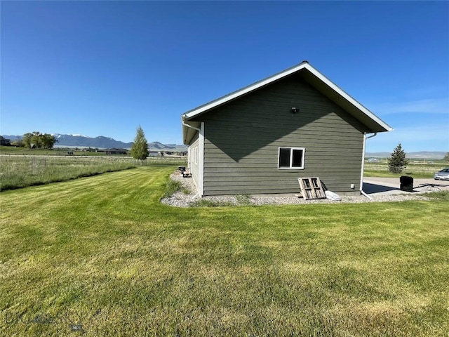 30 Harris Hawk Ct, Dillon, MT 59725 - back of property featuring a mountain view and a yard