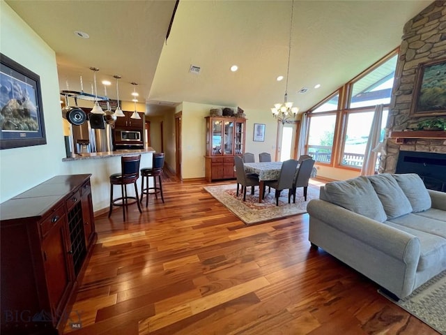 30 Harris Hawk Ct, Dillon, MT 59725 - living area with a chandelier, wood finished floors, a fireplace, baseboards, and recessed lighting