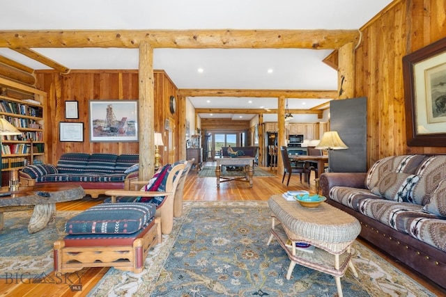 23 Lake Trl, Cameron, MT 59720 - living room featuring wood walls, wood finished floors, and beamed ceiling