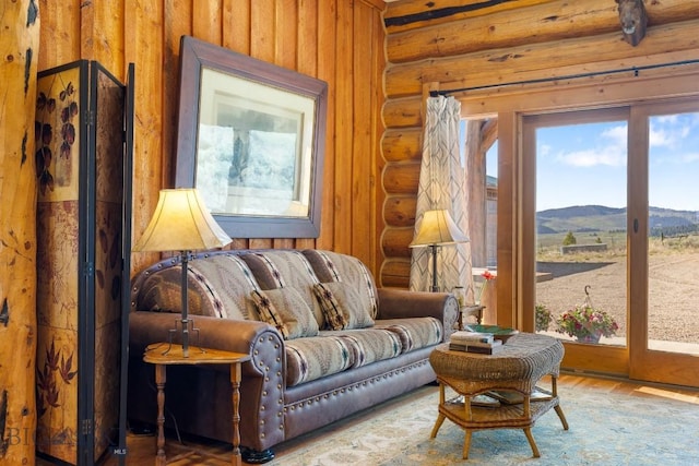 23 Lake Trl, Cameron, MT 59720 - sitting room with rustic walls, a mountain view, and wood finished floors
