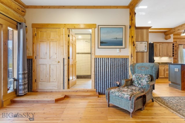 23 Lake Trl, Cameron, MT 59720 - sitting room with light wood-style floors and wainscoting