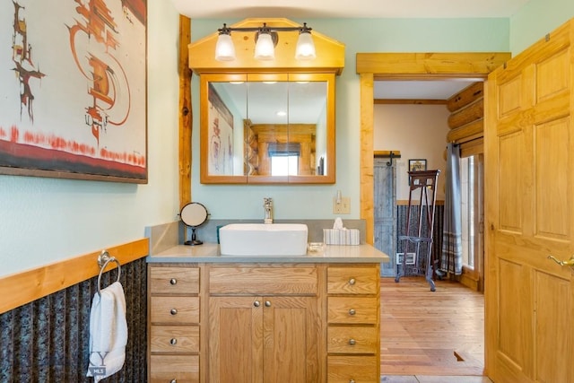 23 Lake Trl, Cameron, MT 59720 - bathroom with vanity, wood finished floors, and healthy amount of natural light