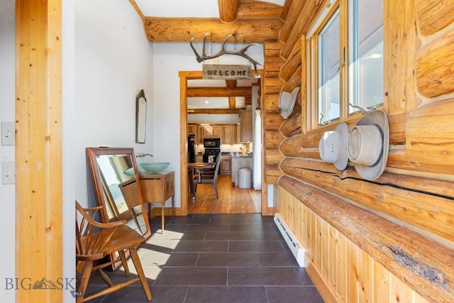 23 Lake Trl, Cameron, MT 59720 - corridor with rustic walls, a baseboard radiator, baseboards, and dark tile patterned floors