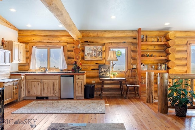 23 Lake Trl, Cameron, MT 59720 - kitchen with dishwashing machine, light wood-type flooring, beam ceiling, recessed lighting, and light brown cabinetry