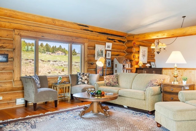 23 Lake Trl, Cameron, MT 59720 - living room featuring rustic walls, wood finished floors, a chandelier, and vaulted ceiling