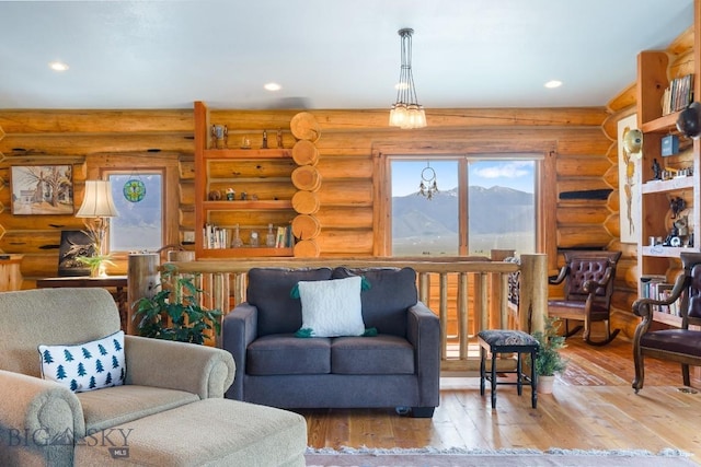 23 Lake Trl, Cameron, MT 59720 - living room featuring wood-type flooring, a mountain view, recessed lighting, and log walls