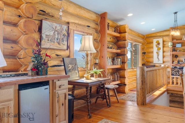 23 Lake Trl, Cameron, MT 59720 - dining space featuring light wood-type flooring, rustic walls, recessed lighting, and a bar