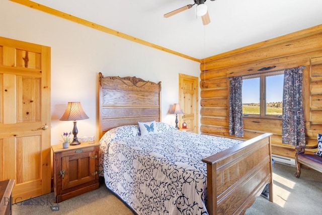23 Lake Trl, Cameron, MT 59720 - carpeted bedroom featuring log walls, a baseboard radiator, and ceiling fan
