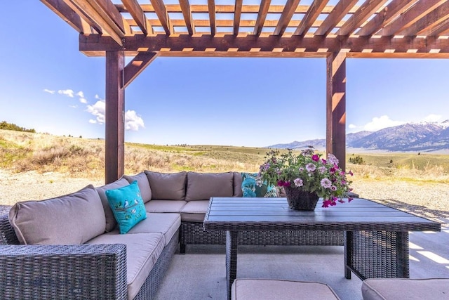 23 Lake Trl, Cameron, MT 59720 - view of patio with outdoor lounge area, a mountain view, and a pergola