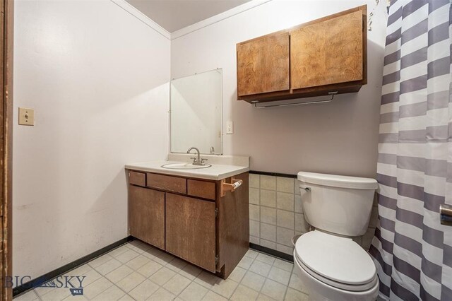 77 First Rd, Whitehall, MT 59759 - full bath with vanity, toilet, crown molding, and tile patterned flooring