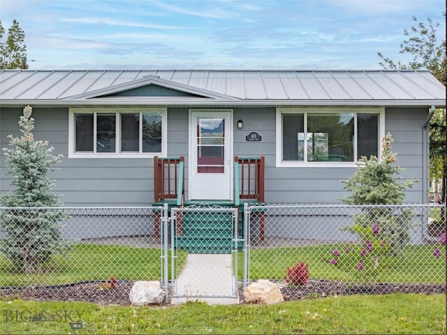 413 S Oak St, Townsend, MT 59752 - view of front of property with a gate, metal roof, and a standing seam roof