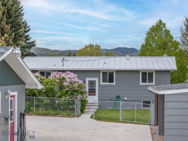 413 S Oak St, Townsend, MT 59752 - rear view of house featuring a mountain view and metal roof