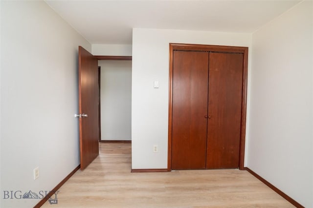 413 S Oak St, Townsend, MT 59752 - unfurnished bedroom with light wood-type flooring, a closet, and baseboards