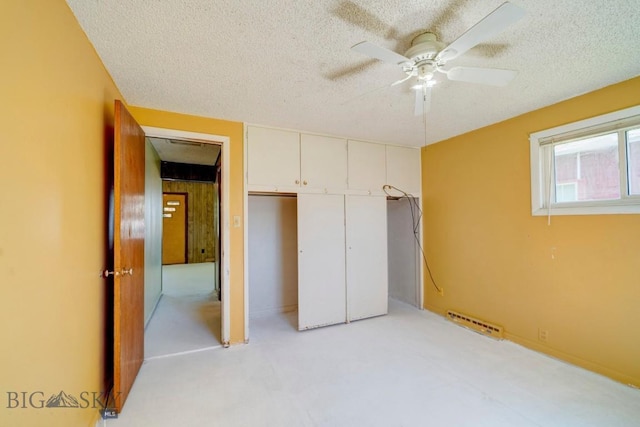 109 N Broadway, Manhattan, MT 59741 - unfurnished bedroom featuring a textured ceiling, a closet, ceiling fan, and light colored carpet