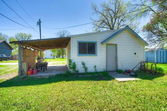 109 N Broadway, Manhattan, MT 59741 - back of property with a lawn and a carport