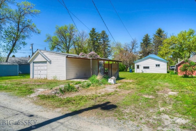 109 N Broadway, Manhattan, MT 59741 - view of yard with an outdoor structure and a garage