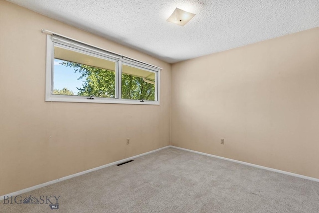 416 Morrow St, Bozeman, MT 59715 - carpeted empty room featuring a textured ceiling and baseboards