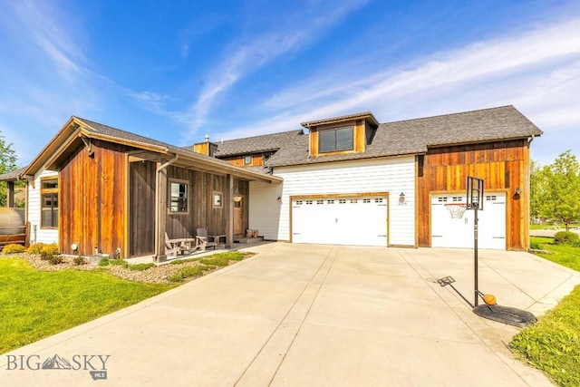 2296 Boylan Rd, Bozeman, MT 59715 - view of front facade featuring concrete driveway, a front yard, and a shingled roof