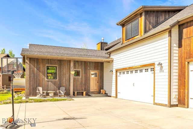 2296 Boylan Rd, Bozeman, MT 59715 - view of front of property featuring driveway, a garage, and a shingled roof