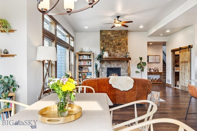 2296 Boylan Rd, Bozeman, MT 59715 - living area featuring a ceiling fan, wood finished floors, a fireplace, recessed lighting, and a barn door