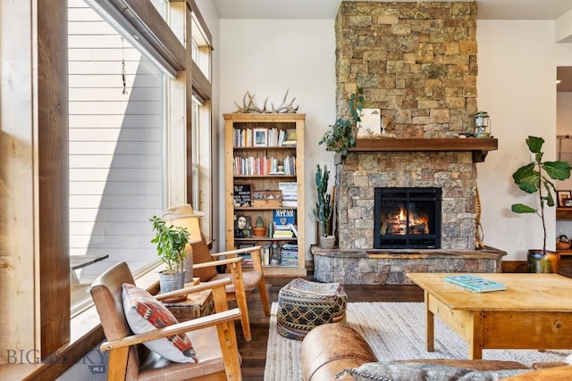 2296 Boylan Rd, Bozeman, MT 59715 - living area with wood finished floors and a stone fireplace