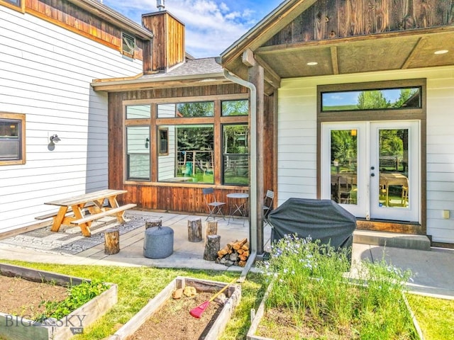 2296 Boylan Rd, Bozeman, MT 59715 - view of patio with a vegetable garden and french doors